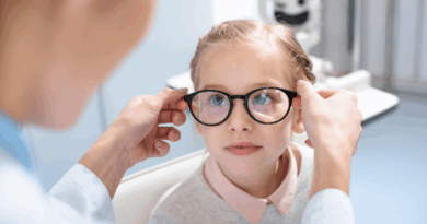 Image of child trying glasses due to visual impairment